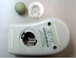 Underside of a ball mouse showing the circular ball cover that twists off for cleaning Underside of a ball mouse showing the circular ball cover that twists off for cleaning